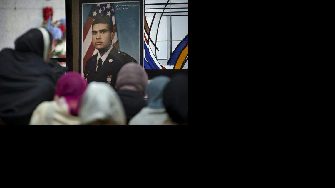 
A photograph of Parminder Singh Shergill is displayed near his body during the funeral services for him at Cherokee Memorial Park in Lodi on Saturday, February 8, 2014. 
