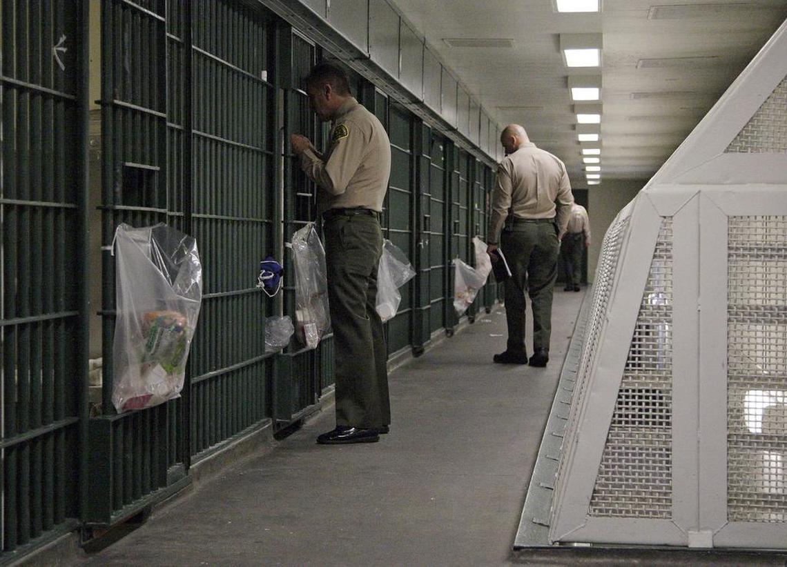 In this October 2012 file photo, Los Angeles County Sheriff’s deputies inspect a cell block at the Men’s Central Jail in downtown Los Angeles. Timothy Atkins was released from an L.A. jail after 23 years behind bars.