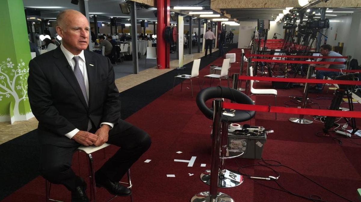 Gov. Jerry Brown is interviewed by CNN at the United Nations climate summit in Le Bourget, France on Dec. 7, 2015