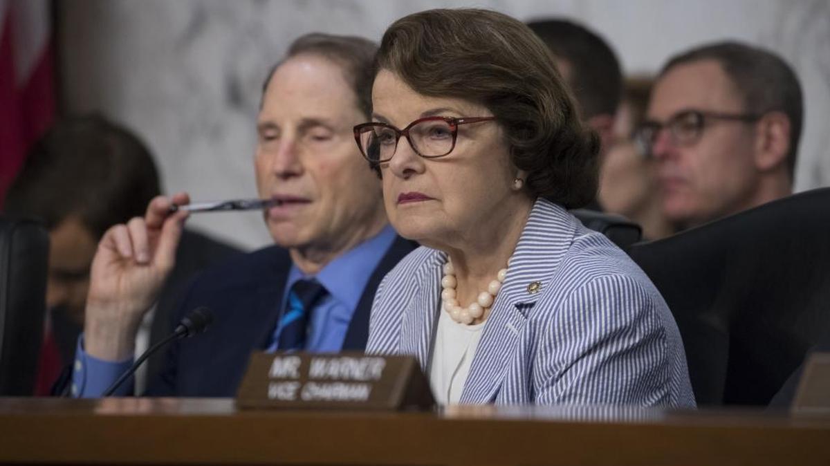 Sen. Dianne Feinstein, D-Calif., right, joined at left by Sen. Ron Wyden, D-Ore., listen as former FBI director James Comey testifies before the Senate Select Committee on Intelligence, on Capitol Hill in Washington, Thursday, June 8, 2017.