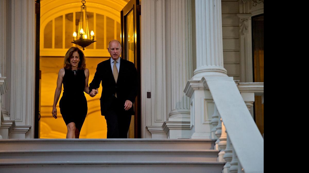 
California Governor Jerry Brown, accompanied by his wife Anne Gust Brown, walks out of the historic Governor's Mansion in midtown Sacramento on election night in June 2014. Evan Westrup, a spokesman for Brown, said in an email that the administration now considers the mansion a “possible residence” for Brown and future governors. California is one of only a handful of states without a permanent governor’s residence, and the sleeping arrangements of the state’s chief executives have been a persistent, if relatively minor, source of consternation.
