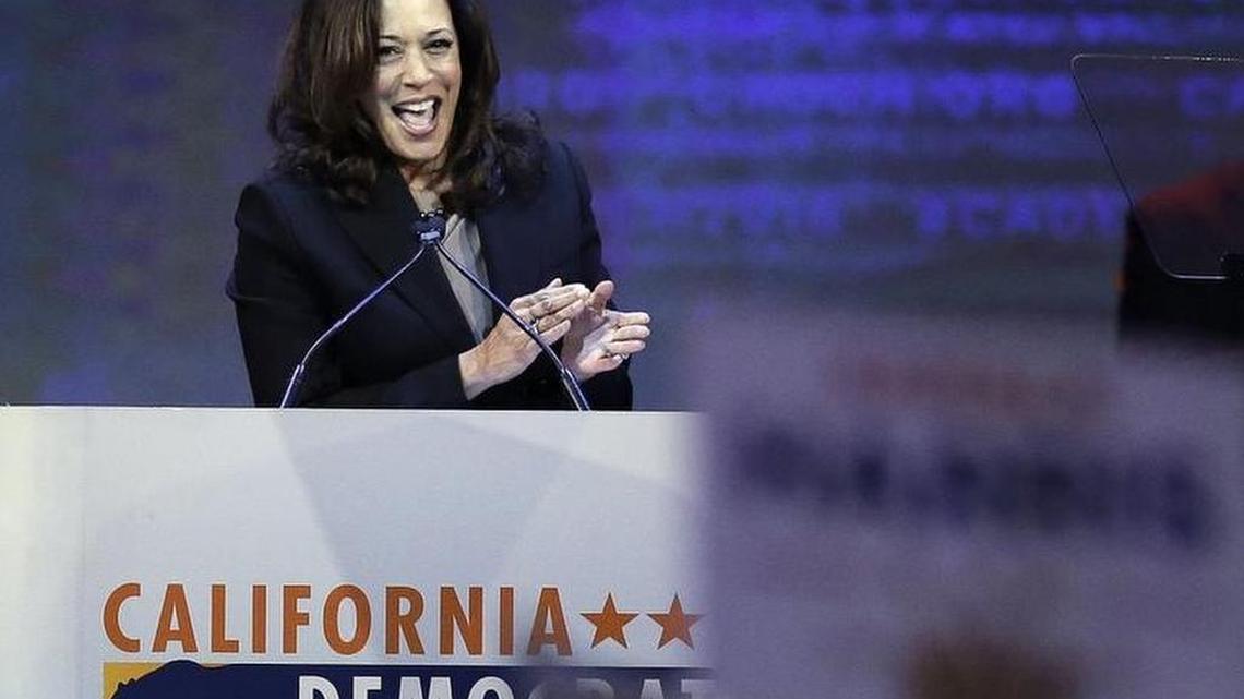 California Attorney General Kamala Harris applauds prior to speaking before the California Democrats State Convention on Saturday.