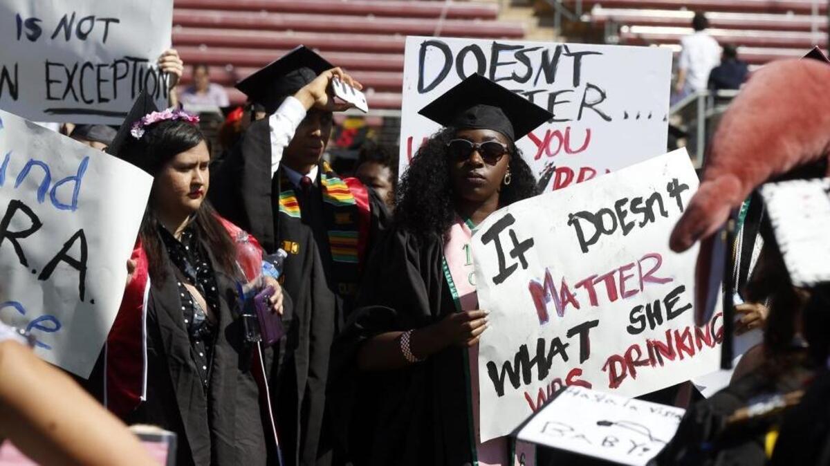 Protesters demonstrate during Stanford University graduation exercises on Sunday, June 12, 2016.
