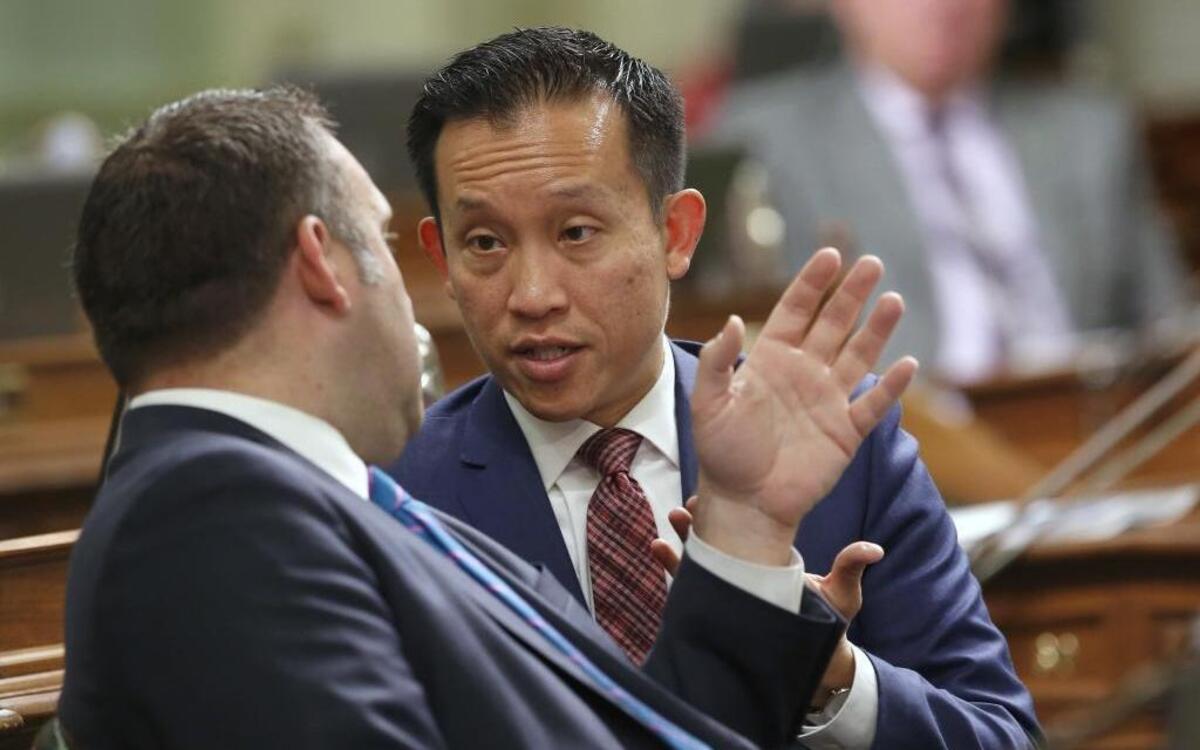 Assemblyman David Chiu, D-San Francisco, right, talks with Assemblyman Adam Gray, D-Merced, during the Assembly session, Thursday, May 12, 2016.