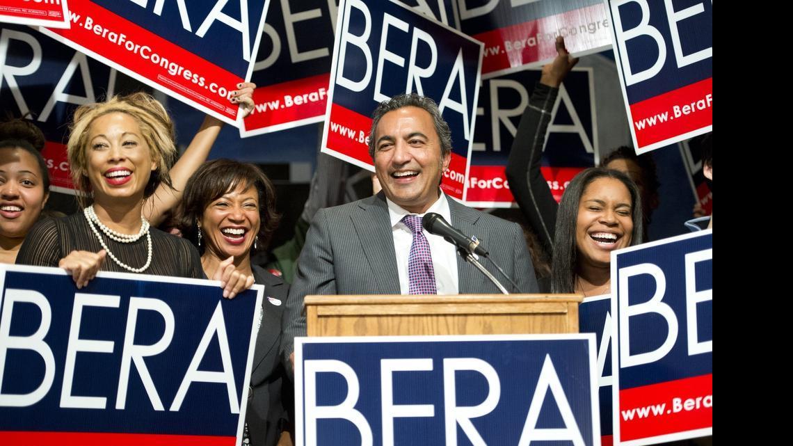 
Rep. Ami Bera, D-Elk Grove, flanked by daughter Sydra Bera, right, and wife Janine Bera, left, applaud him at Elks Lodge on Nov. 5, 2014 in Carmichael, Calif.
