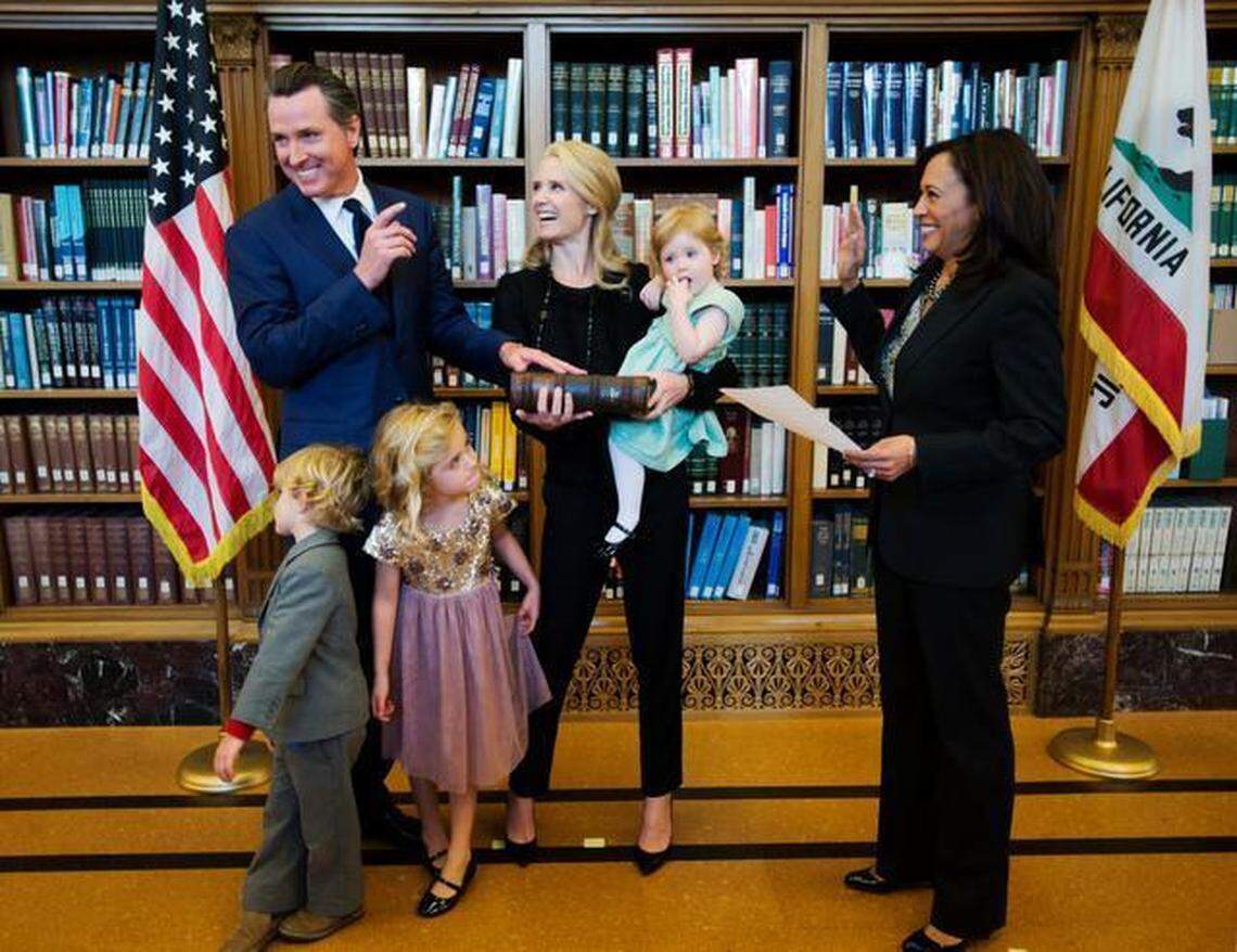 Lt. Gov. Gavin Newsom is sworn into his second term in the office by state Attorney General Kamala Harris on Jan. 5, 2015, in Sacramento. Newsom is joined by his wife, Jennifer Siebel Newsom, and their children Montana, 5, Hunter, 4, and Brooklynn, 2.