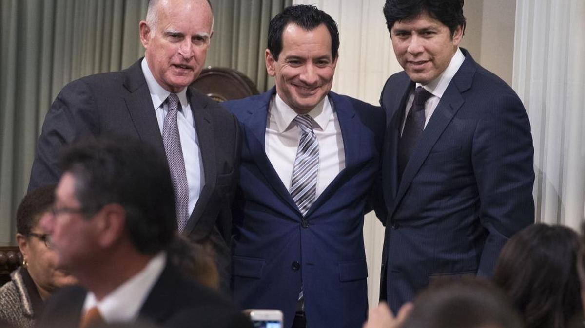 Assembly Speaker Anthony Rendon, center, stands with Gov. Jerry Brown, left, and Senate Pro Tem Kevin de Leon after he was sworn in as the new Assembly speaker on March 7, 2016. Democrats now have a supermajority in both houses.