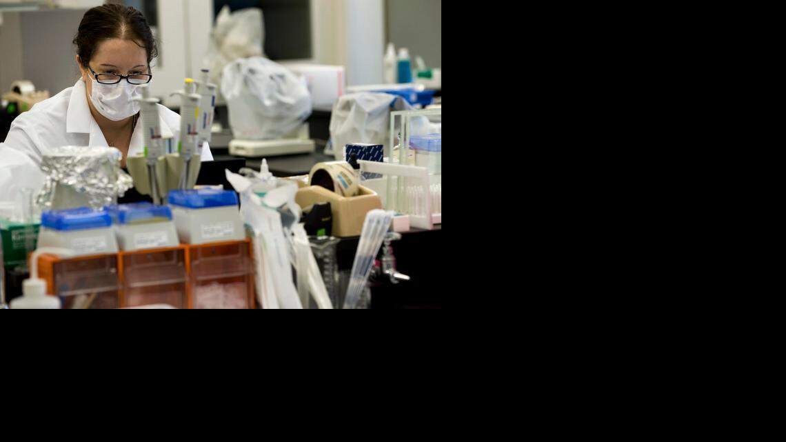 Nikki Sewell, a Criminalist with the Sacramento District Attorney's Crime Lab, works on DNA samples in 2010.