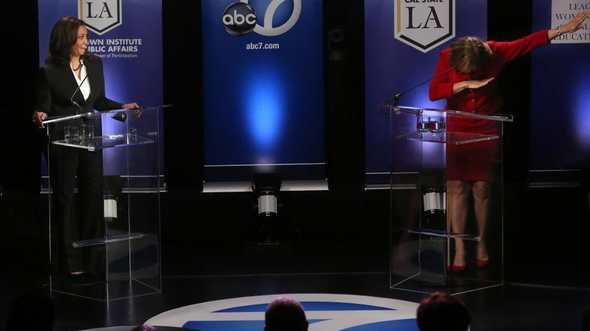 Candidate Kamala Harris watches as fellow Democrat Loretta Sanchez strikes a pose at the end of her closing statement during their U.S. Senate debate held Wednesday at Cal State Los Angeles.