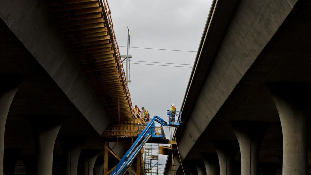 
Workers work on a section of U.S. Highway 50 in 2014. A coalition of local governments, unions and business groups will put forward a transportation funding plan Monday.
