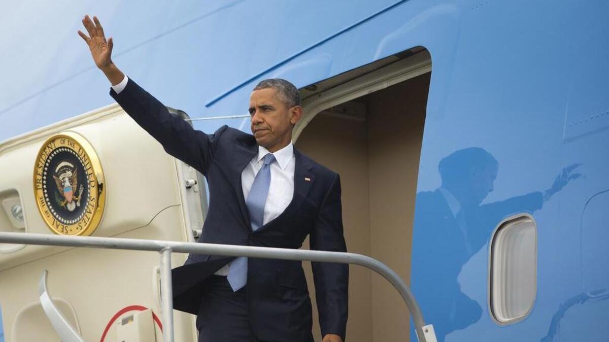 
President Barack Obama waves as he boards Air Force One in Eugene, Ore., Friday, Oct. 9, 2015. Obama traveled to nearby Roseburg, Ore., to meet with families of the victims of the Oct. 1, shooting at Umpqua Community College, as part of a four-day West Coast tour. Obama is also scheduled to attend a fundraiser event later today in Seattle with Sen. Patty Murray, D-Wash. He's is also attending fundraisers in San Francisco and Los Angeles during the four-day visit.
