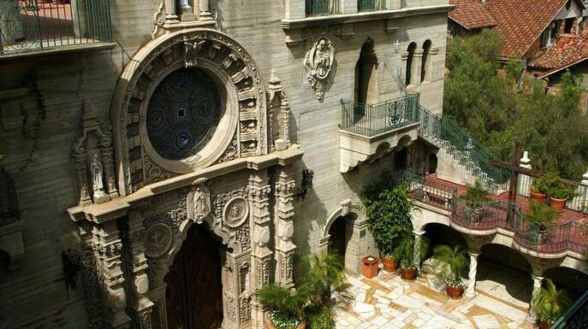
The chapel entrance, left, and courtyard outside is one of the more beautiful spots at The Mission Inn in Riverside, Calif. 
