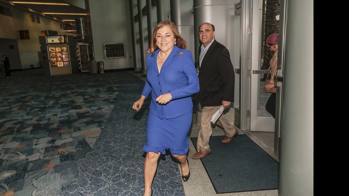 
Congresswoman Loretta Sanchez rushes between events at the California Democratic Party convention in Anaheim on Saturday. On Sunday, Sanchez, a U.S. Senate candidate, apologized for her Native American “war cry” during a convention meeting Saturday.
