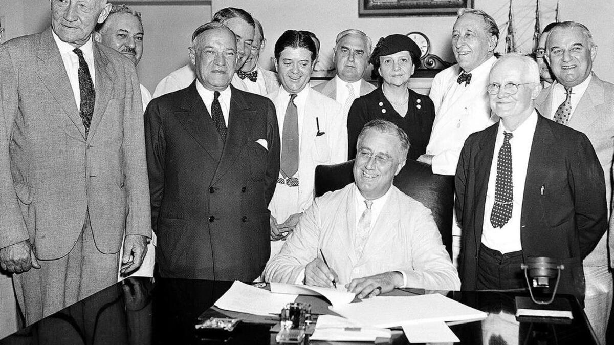 
In this Aug. 14, 1935, file photo, President Franklin Roosevelt signs the Social Security Act in Washington, D.C.. 
