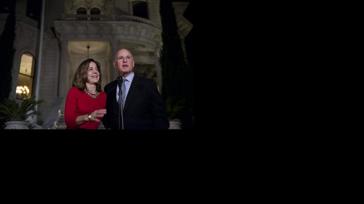 
Gov. Jerry Brown with first lady Anne Gust Brown on election night outside the historic governor's mansion in Sacramento, Calif., on Tuesday, November 04, 2014.
