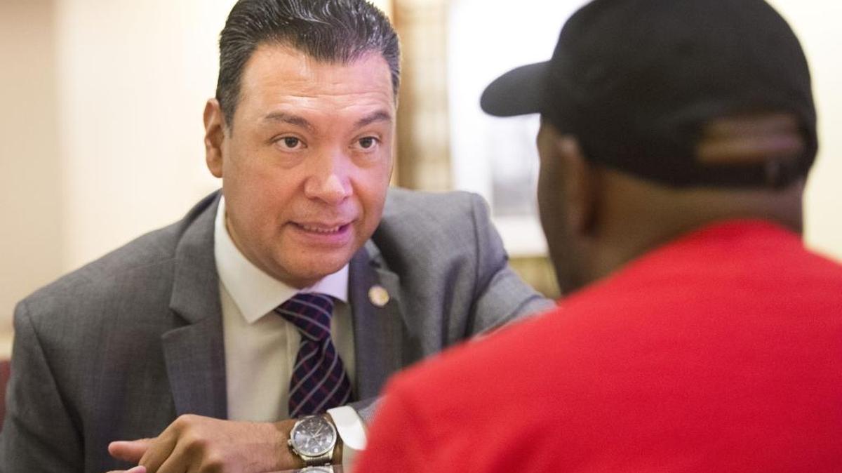 California Secretary of Sate Alex Padilla meets with a delegate at the Democratic national convention in July. Padilla challenged President-elect Donald Trump to back up his claims of voter fraud in California and other states.