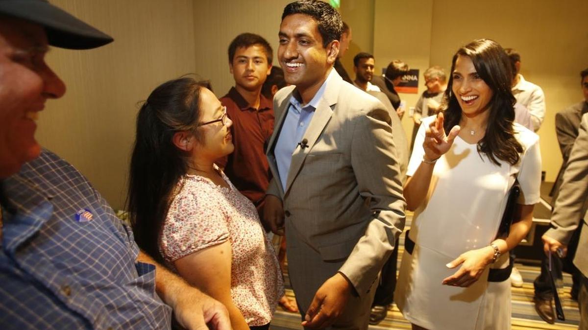 Ro Khanna, center, and then-girlfriend Ritu Ahuja, right, greet supporters at the Aloft Hotel in Cupertino, Calif., on June 3, 2014.