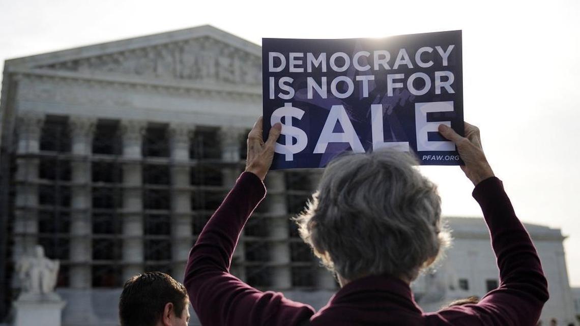 People protest during oral arguments in a campaign-finance case at the US Supreme Court in October 2013. Proposition 59 on California’s November 2016 ballot asks voters if the decision should be overturned.