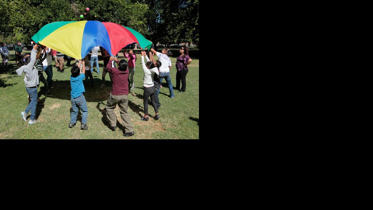 In 2012, children and adults exercise as part of a wellness program run jointly by the La Familia Counseling Center and the YMCA in Sacramento.