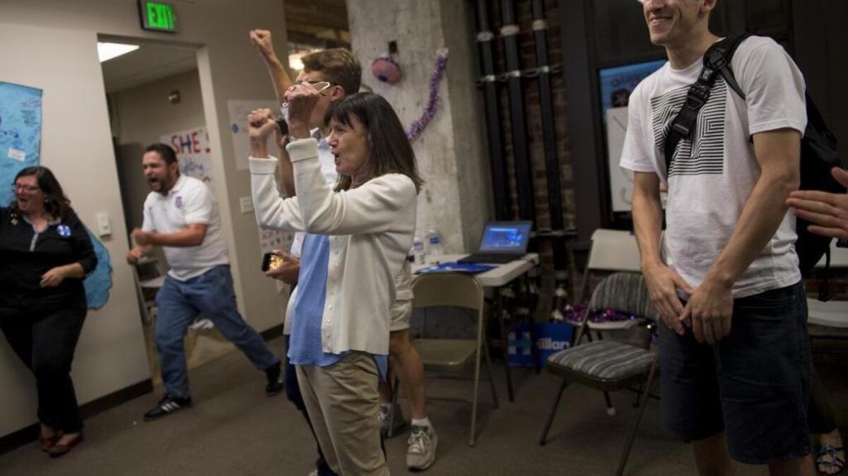 Jan Brown, a delegate of Placer County, celebrates after seeing the numbers come in in favor of democratic presidential candidate Hillary Clinton at a watch party during the California primary election on Tuesday, June 7, 2016, in Sacramento, Calif.