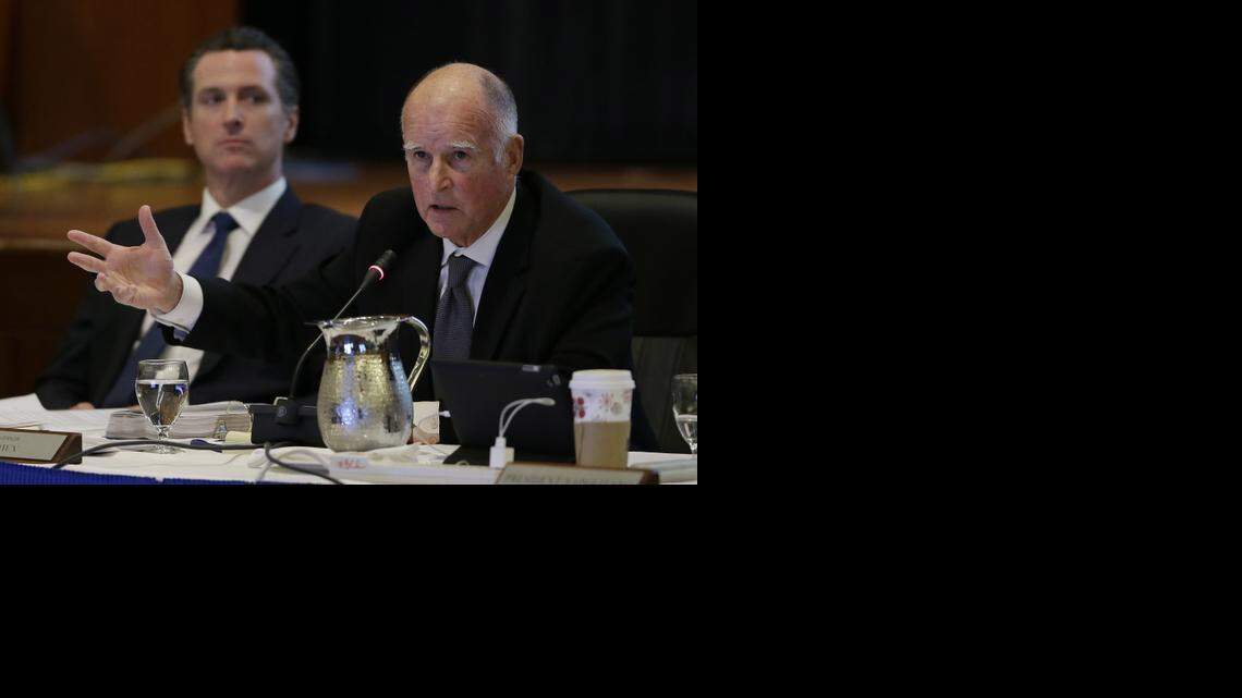 
Gov. Jerry Brown, right, gestures while speaking out against tuition increases as Lt. Gov. Gavin Newsom, left, listens during a November meeting of the University of California Board of Regents in San Francisco.
