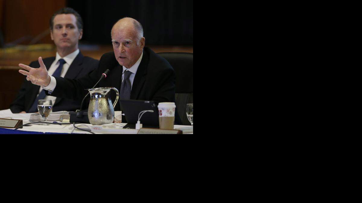 
Gov. Jerry Brown, right, gestures while speaking out against tuition increases as Lt. Gov. Gavin Newsom, left, listens during a November meeting of the University of California Board of Regents in San Francisco.
