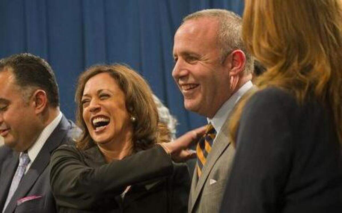 
Attorney General Kamala Harris, center, jokes with then-Senate President pro Tem Darrell Steinberg, right, at a press conference after the California Homeowner Bill of Rights passes the Legislature. Photo taken July 02, 2012 in Sacramento, California.
