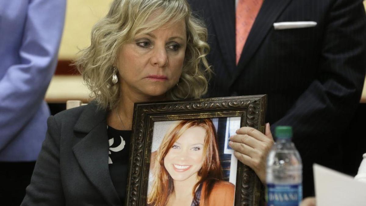 Debbie Ziegler holds a photo of her daughter, Brittany Maynard, the California woman with brain cancer who moved to Oregon to legally end her life, during a Capitol news conference to announce the reintroduction of assisted death legislation on Aug. 18, 2015.