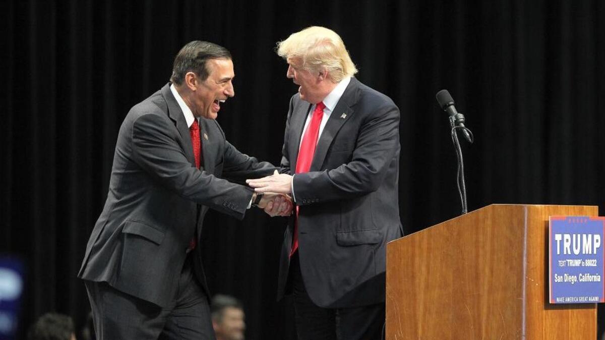 Congressman Darrell Issa, left, greets Republican presidential candidate Donald Trump at a campaign rally, Friday, May 27, 2016, in San Diego. (John Gastaldo/The San Diego Union-Tribune via AP)