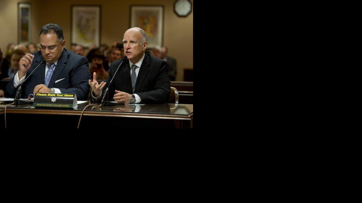 
Gov. Jerry Brown and then-Assembly Speaker John A. Perez speak to an Assembly committee in Sacramento, Calif. on April 28, 2014.
