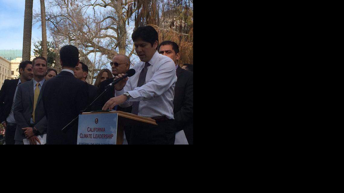 
Senate President Pro Tem Kevin de León prepares to speak at a news conference in Sacramento on Tuesday, where he announced a new legislative package that includes measures to cut petroleum use in half by 2030 and to expand, from one-third to one-half, the proportion of electricity California derives from renewable sources such as wind and solar.
