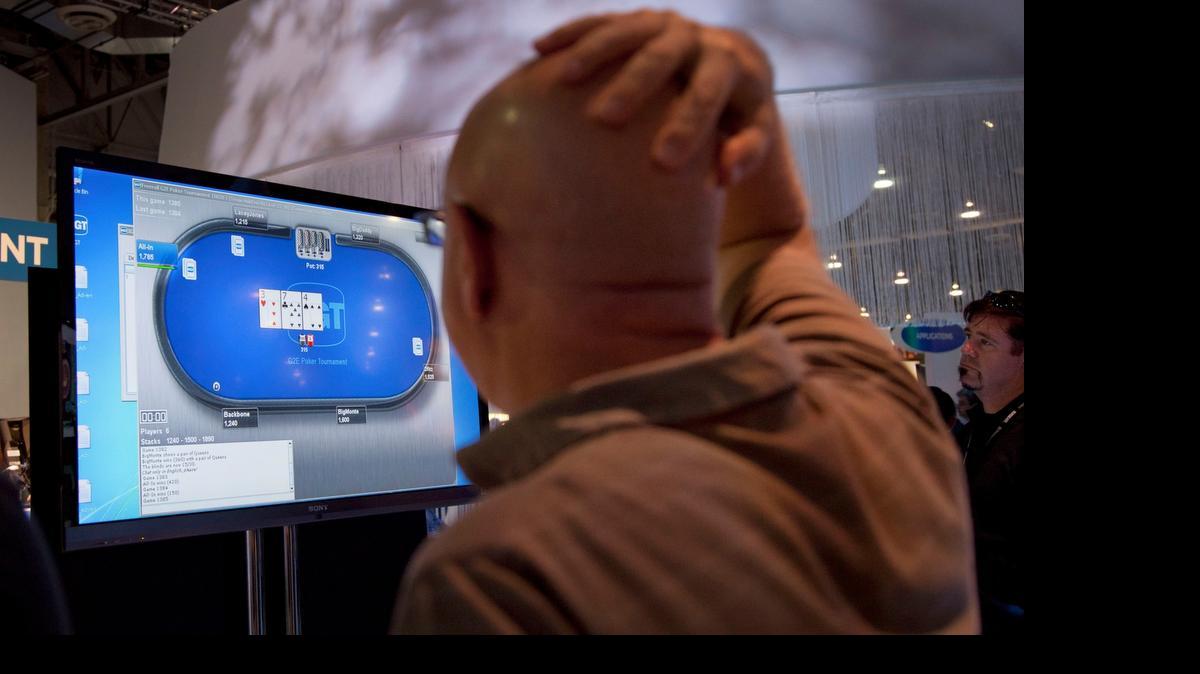 
Online poker, seen being played in Las Vegas in 2011, is the focus of a long-running political battle in California and the nation. A Las Vegas casino baron hopes to have it outlawed nationwide, while a bill to legalize it in California has advanced further than it has in years.
