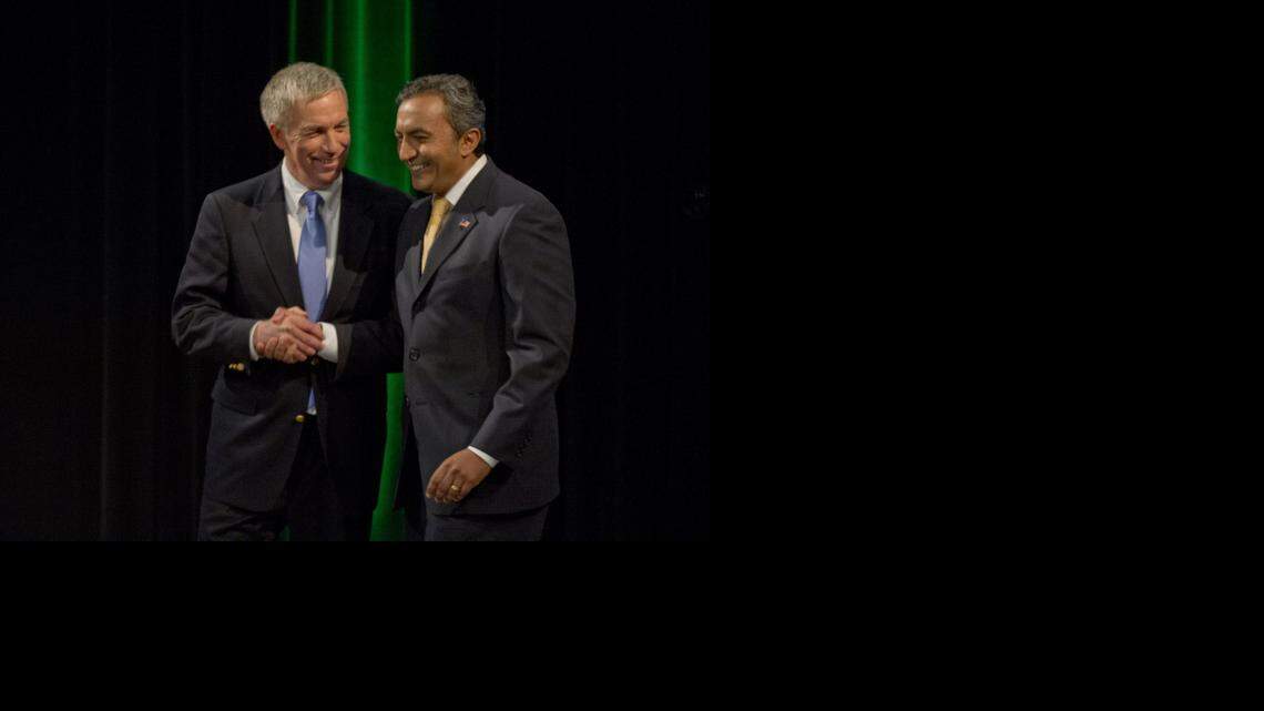 
Democratic Rep. Ami Bera, right, and Republican Doug Ose, left, shake hands after debating at the KVIE studio last month in Sacramento.
