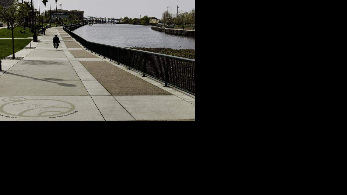 
A cyclist rolls along the Joan Darrah Promenade at the Stockton Marina.