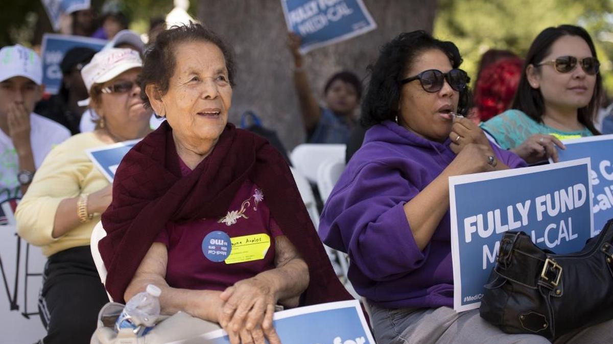 
In this file photo, Ramona Avalos, of Los Angeles left listens to speakers during the Medi-Cal Rally at the State Capitol on Tuesday, June 2, 2015. The Medi-Cal program receives money from the existing tax on managed-care organizations that serve Medi-Cal patients.
