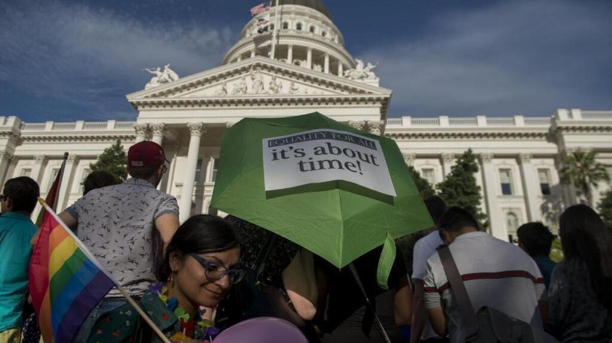 Shannon Muir and Debra Cooper celebrate the U.S. Supreme Court ruling legalizing gay marriage on the steps of the California State Capitol on June 26, 2015.