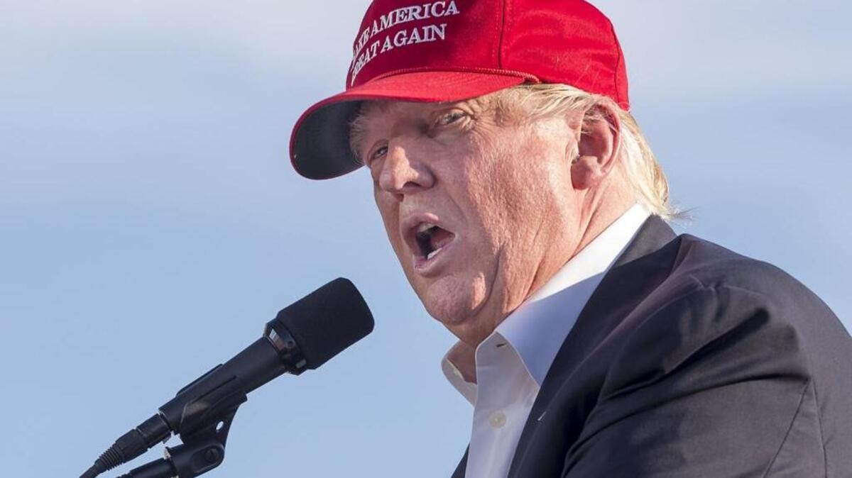 Republican Presidential candidate Donald Trump speaks to supporters at the Sacramento International Jet Center on Wednesday.