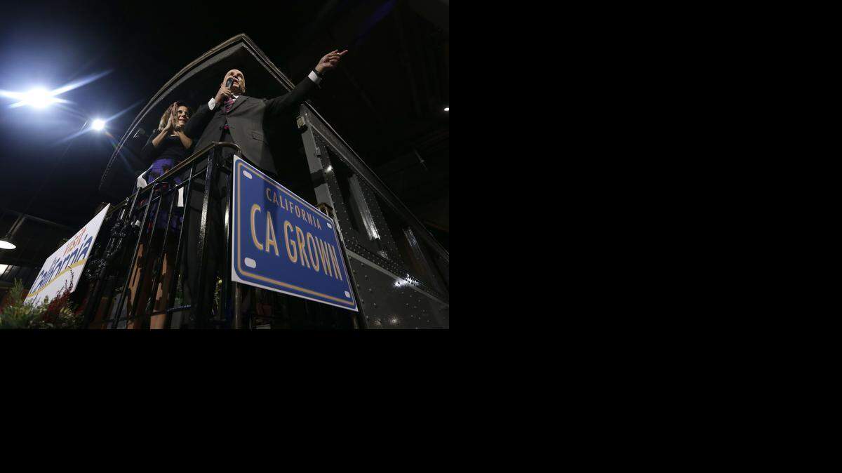 
Standing on the back platform of a railroad car, Gov. Jerry Brown, accompanied by his wife, Anne Gust Brown, addresses a crowd at an inaugural reception held in his honor at the California State Railroad Museum in Sacramento, Calif., Monday, Jan. 5, 2015.
