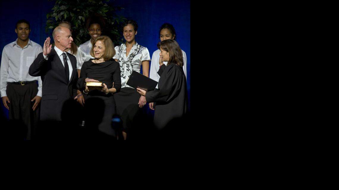 
Jerry Brown, with his wife, Anne Gust Brown, is sworn in during his inauguration at Memorial Auditorium on Monday, January 3, 2011
