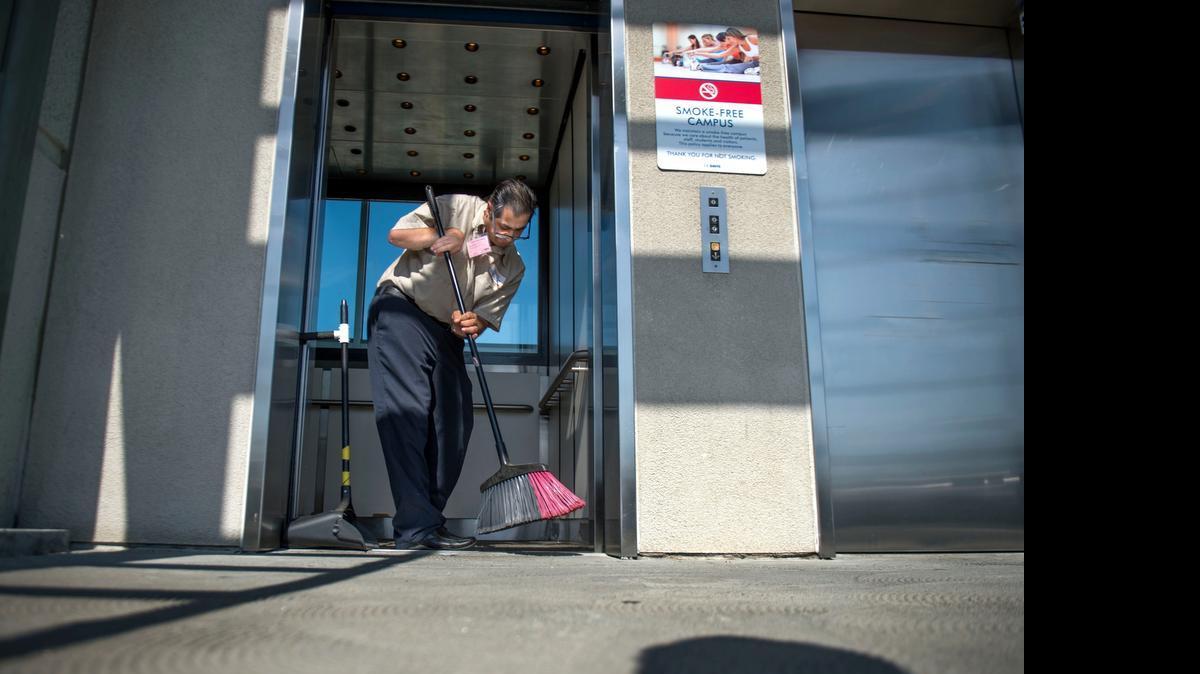 
Pete Amirani of Fair Oaks sweeps an elevator at the Lawrence J. Ellison Ambulatory Care Center at UC Davis Medical Center this week. Amirani works with InAlliance, a nonprofit that provides housing, employment and other services to clients with developmental and intellectual disabilities. Amirani spends Tuesdays and Thursdays keeping the elevators and surrounding areas clean.
