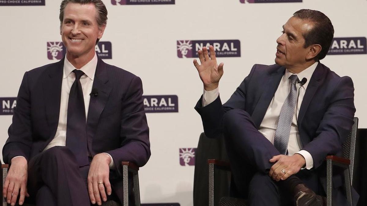 Democratic candidates for California governor Gavin Newsom, left, smiles as Antonio Villaraigosa speaks at a NARAL Pro-Choice California event in San Francisco, Tuesday, Jan. 30, 2018.