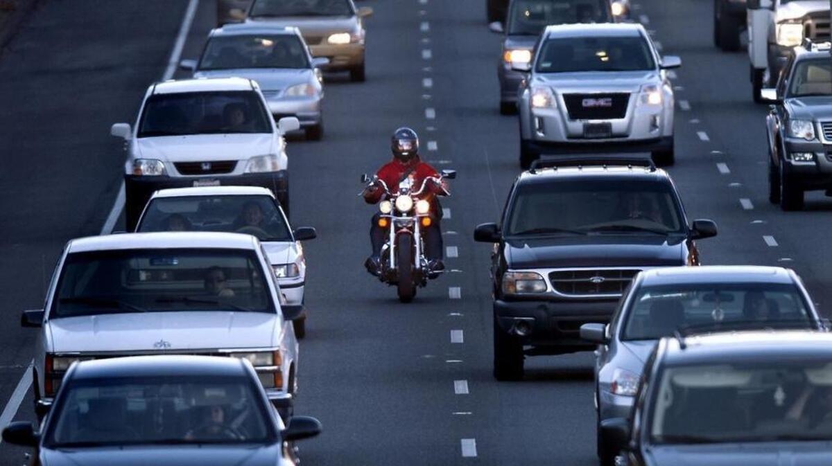 A motorcyclist rides between the lanes during the afternoon commute on southbound highway 99 in Sacramento on Tuesday, February 5, 2013. Wednesday, California sent a list of more than 50 projects to the National Governors Association for possible inclusion in a federal infrastructure package, including adding HOV lanes on Interstate 5 between Elk Grove and Sacramento.