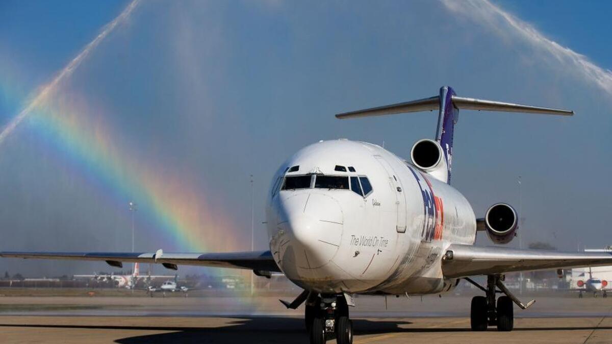 A Boeing 727 gets a water tribute as it taxis to a stop during a ceremony at the Sacramento City College Aeronautics Hangar at McClellan Park Airfield in North Highlands on Friday, February 15, 2013.