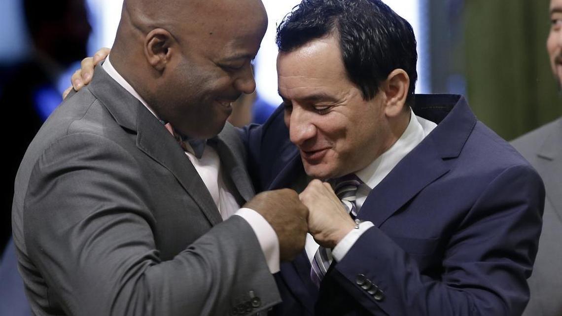 Assemblyman Anthony Rendon of Lakewood, right, gets a fist bump from Sen. Isadore Hall of Compton before his election as the next Assembly speaker on Monday, Jan. 11, 2016. Hall is running for Congress and has been endorsed by Rendon.