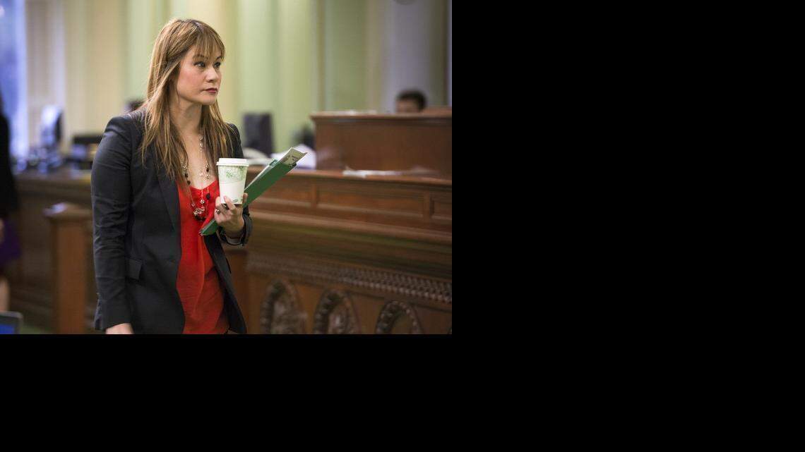 
Assemblywoman Ling-Ling Chang leaves the chambers at the end of session on Thursday, Feb. 19, 2015. 
