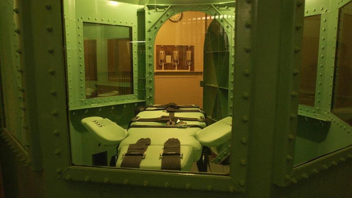 The phones to stop an execution hang on the wall in the background near the execution chamber of San Quentin State Prison in June 2003.