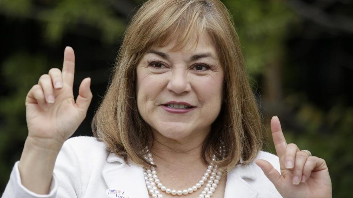 U.S. Senate candidate Loretta Sanchez stops to chat after casting her vote in the June 7 primary election. Trailing Kamala Harris, a fellow Democrat, she is taking her case to conservative voters ahead of the general election.