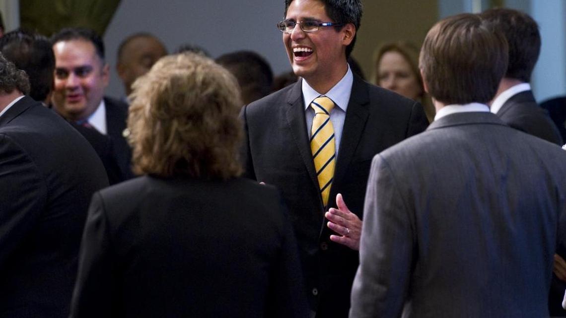 Assemblyman Henry Perea, D-Fresno, being sworn in with new and returning members of the California Assembly on Monday, Dec. 6, 2010.