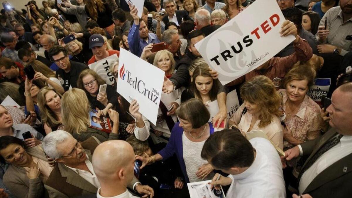 Republican presidential candidate Sen. Ted Cruz of Texas signs his autograph after a campaign event in Irvine, California. Cruz looks to California as a source of delegates to help him deny Donald Trump an open path to the GOP nomination.