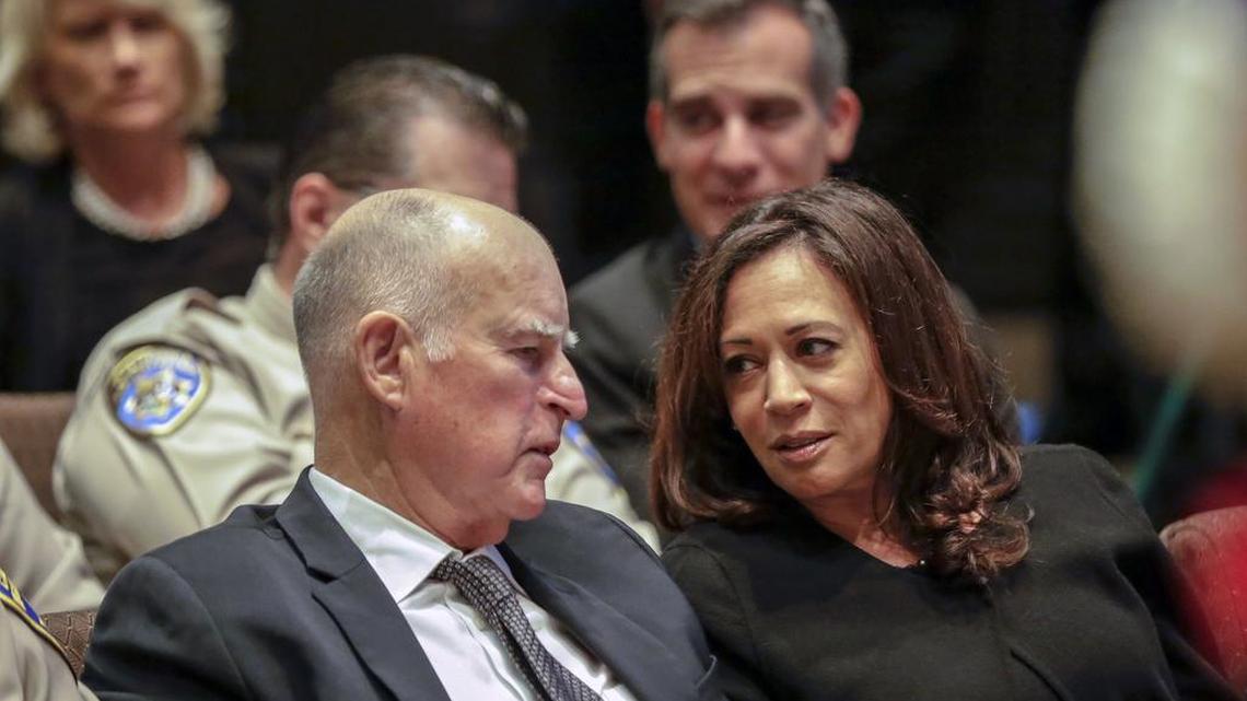 Gov. Jerry Brown talks with Attorney General Kamala Harris on Thursday, Oct. 13, 2016, in Lancaster, Calif. Now that Harris has won a seat in the U.S. Senate, Brown must make the high-stakes decision of who fills her old job.